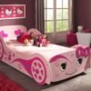 Love Princess car bed in a carriage design with a low-profile MDF frame and regal white detailing for a toddler's bedroom.